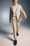 Costum pentru băiat Liam bej – pantaloni și sacou descheiat, în mișcare, din față